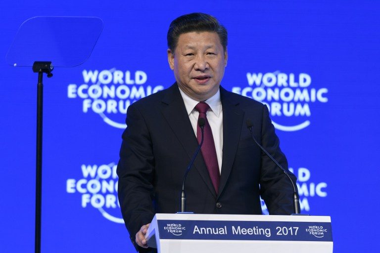 'GLOBALIZATION TO STAY' China's President Xi Jinping delivers a speech during the first day of the World Economic Forum, on January 17, 2017 in Davos. Fabrice Coffrini/AFP 