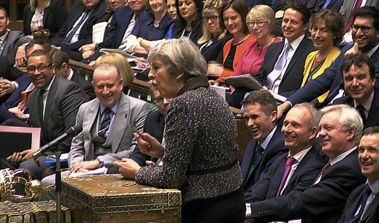 In a still image taken from video footage broadcast by the UK Parliamentary Recording Unit on January 25, 2017 British Prime Minister Theresa May answers a question during the weekly Prime Minister's Questions session in the House of Commons in central London on January 25, 2017. PRU/AFP 