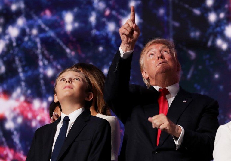 YOUNGEST SON. In this file photo, Donald Trump reacts as his son Barron Trump looks on at the end of the Republican National Convention on July 21, 2016 at the Quicken Loans Arena in Cleveland, Ohio. Chip Somodevilla/Getty Images/AFP 