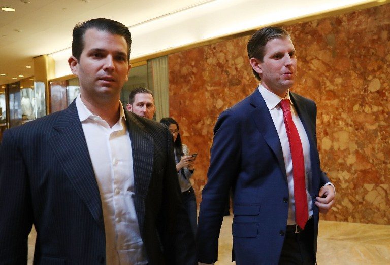 RUNNING THE BUSINESS. Donald Trump's sons Donald Trump Jr., (L), and Eric Trump, walk in Trump Tower on November 14, 2016 in New York City. Spencer Platt/Getty Images/AFP 