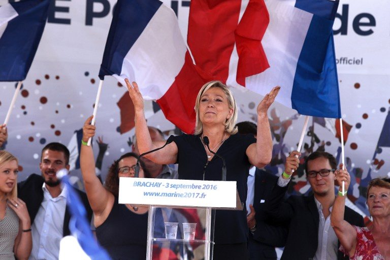 This file photo taken on September 03, 2016 shows French far-right party Front National (FN) President and member of the European Parliament, Marine Le Pen gesturing as she delivers a speech during a FN political rally in Brachay, northeastern France. Francois Nascimbeni/AFP 