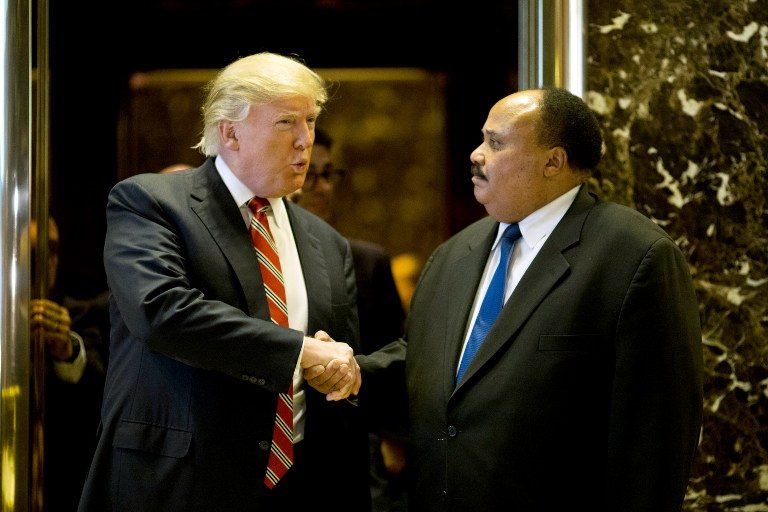 TRUMP MEETS MLK'S SON. US President-elect Donald Trump shakes hands with Martin Luther King III after meeting at Trump Tower in New York City on January 16, 2017. Dominick Reuter/AFP 