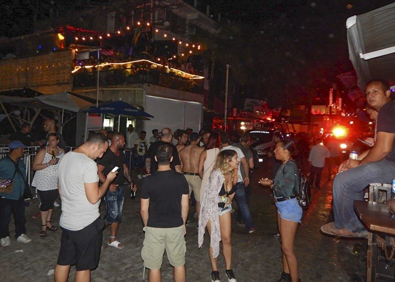 OUTSIDE THE CLUB. People remain in the street outside the Blue Parrot nightclub in Playa del Carmen, Quintana Roo state, Mexico where 5 people were killed, three of them foreigners, during a music festival on January 16, 2017. Victor Vargas/AFP 