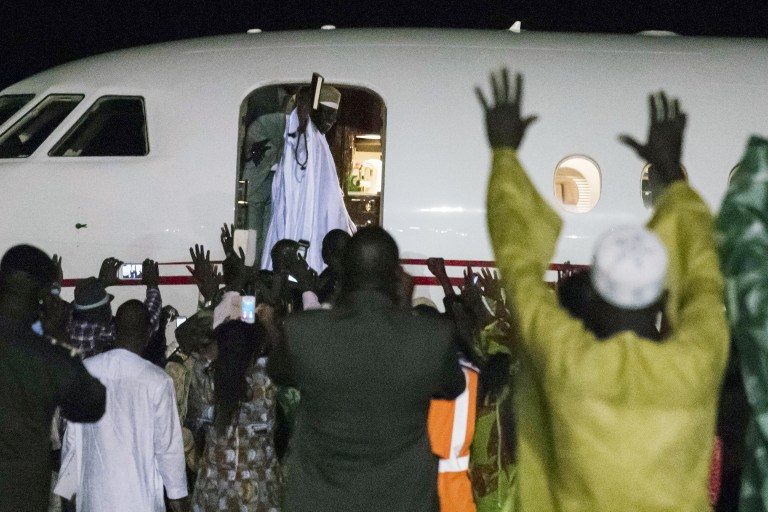 DEPARTURE. Former president Yahya Jammeh, the Gambia's leader for 22 years, waves from the plane as he leaves the country on 21 January 2017 in Banjul. Stringer/AFP 