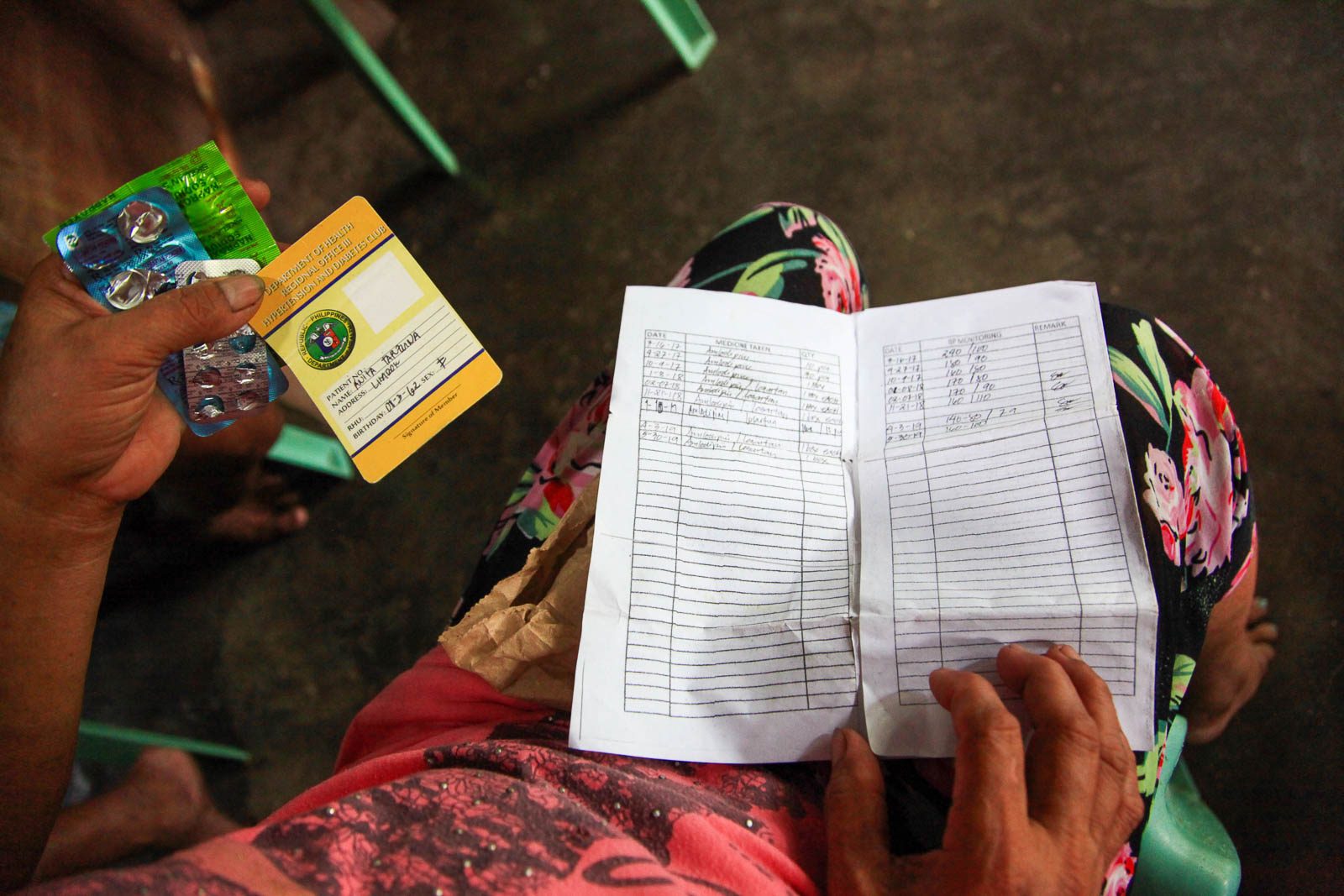 MEDICATION. Anita Tarzuna shows the high blood medication issued to her by the local health office. Photo by Kathleen Lei Limayo 