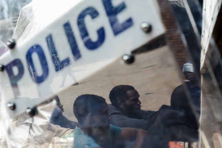 Zimbabwe police erect road blocks to hunt protesters