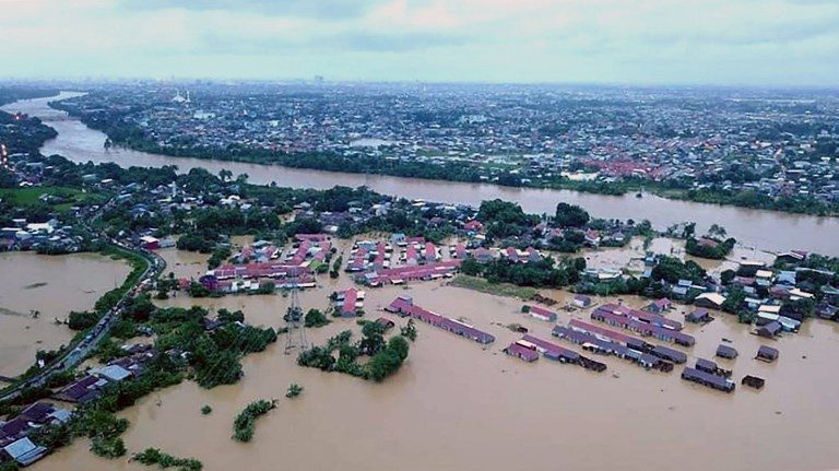 Floods, landslides kill at least 8 in Indonesia