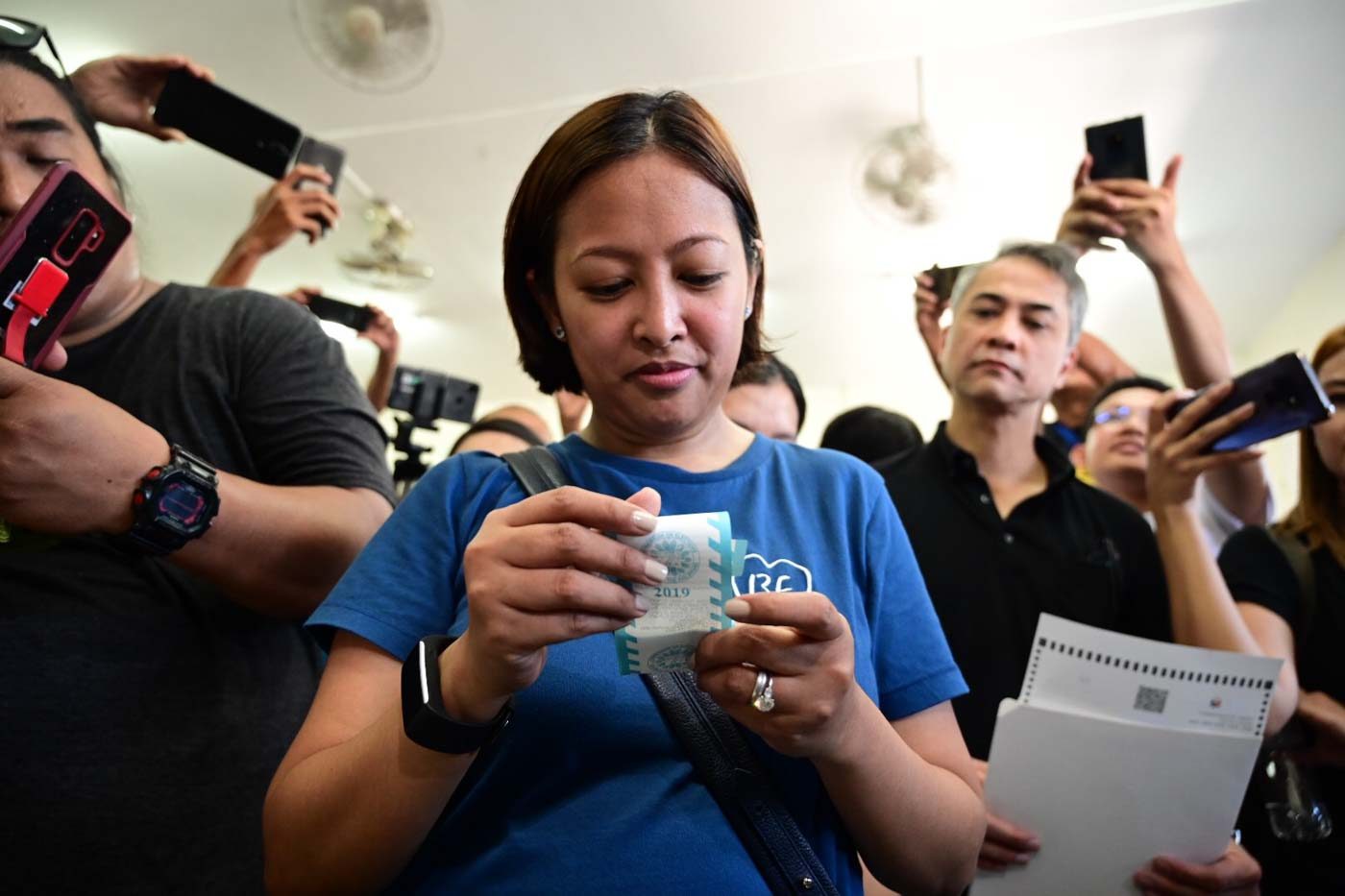 FINAL CHECK. Reelectionist Makati Mayor Abby Binay inspects her ballot receipt after voting in San Jose Elementary School, Makati. Photo by Alecs Ongcal/Rappler  