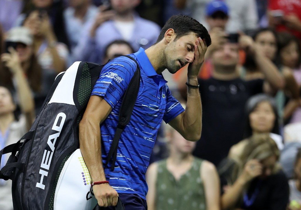 Djokovic quits as Wawrinka advances; Federer rolls at U.S. Open
