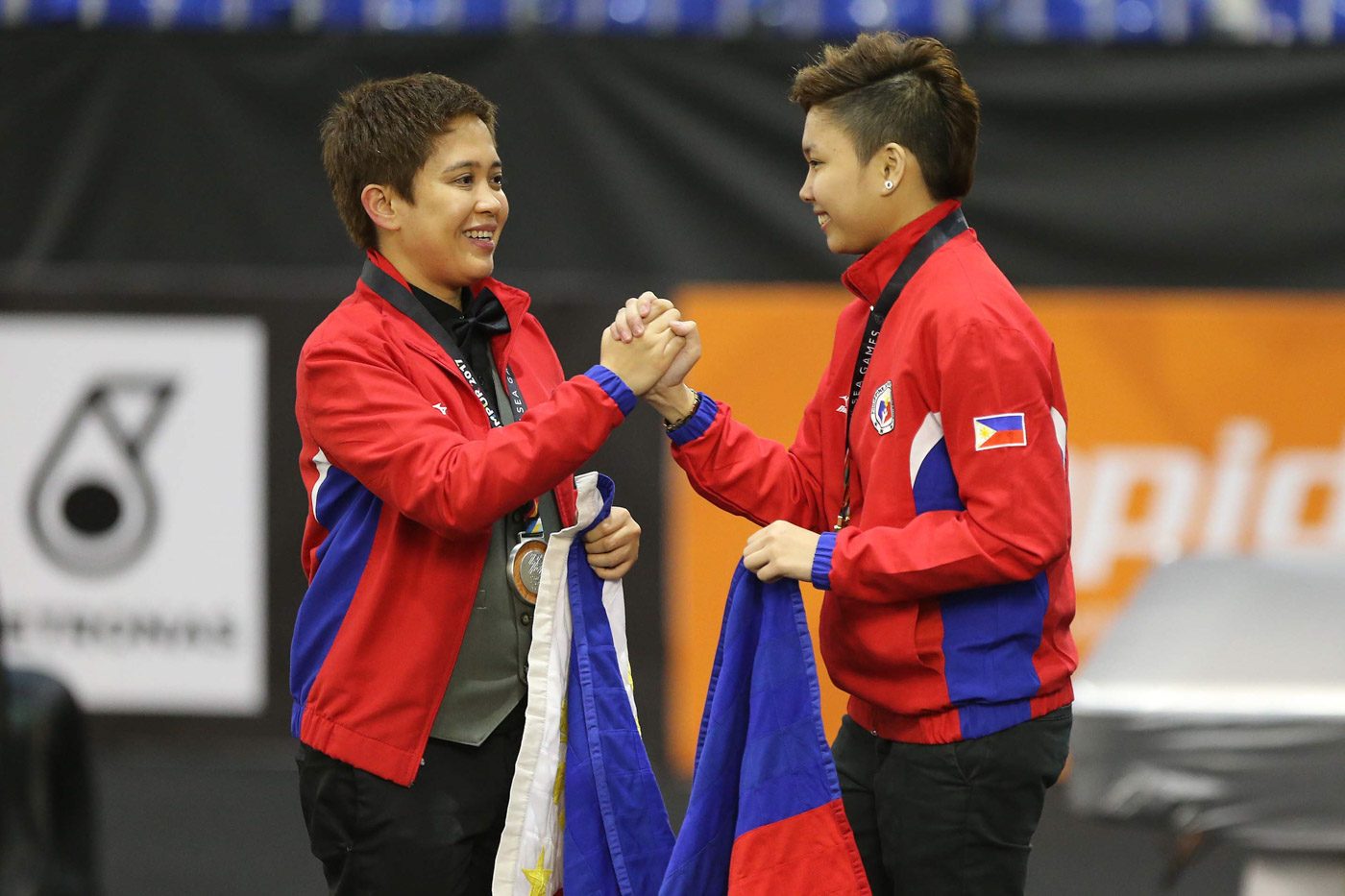 1-2 FINISH. Cheska Centeno (R) and Rubilen Amit of the Philippines celebrate after winning gold and silver medals, respectively, in the women's 9-ball singles event. This is the second straight SEA Games that Centeno and Amit faced in the final and won the gold and silver. Photo from PSC-POC Media 