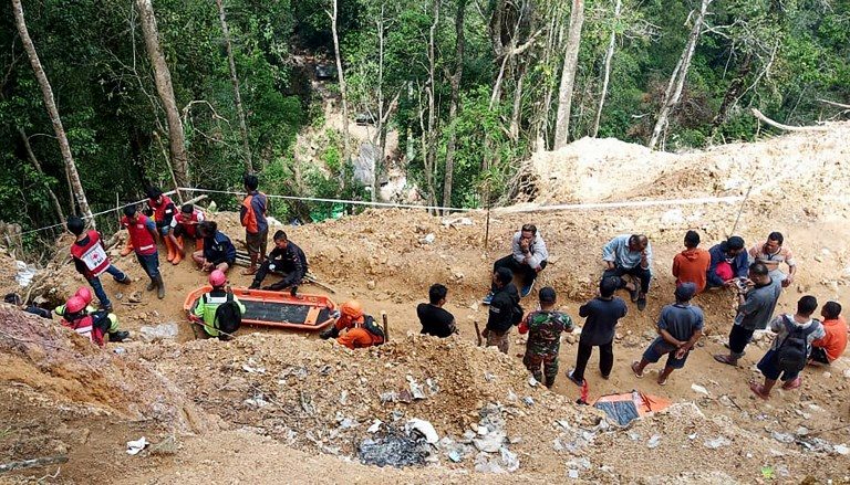 8 dead in Indonesia mine collapse as excavator digs for survivors