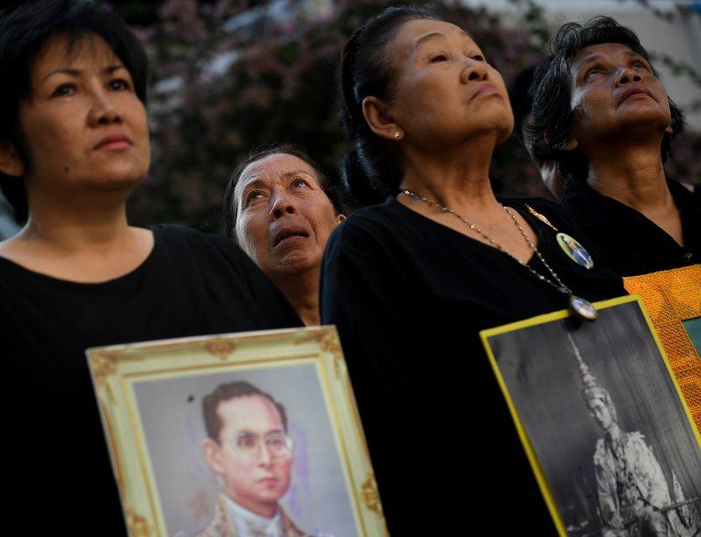Black-clad Thais mourn king as nation holds Buddhist rites