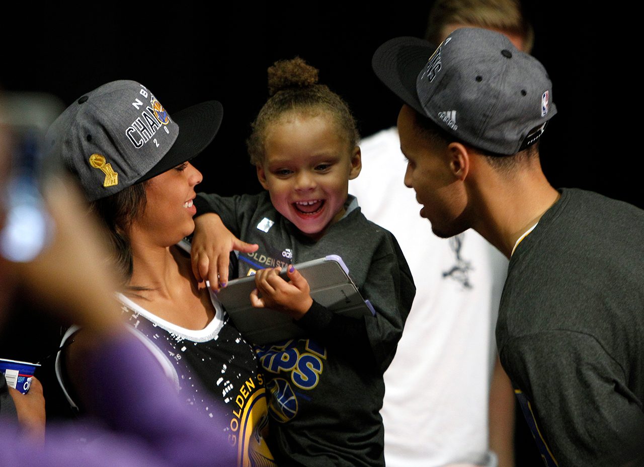 Stephen Curry, his daughter Riley and his wife Ayesha have a moment after the NBA Finals press conference in game 6. Photo by DAVID MAXWELL/EPA 
