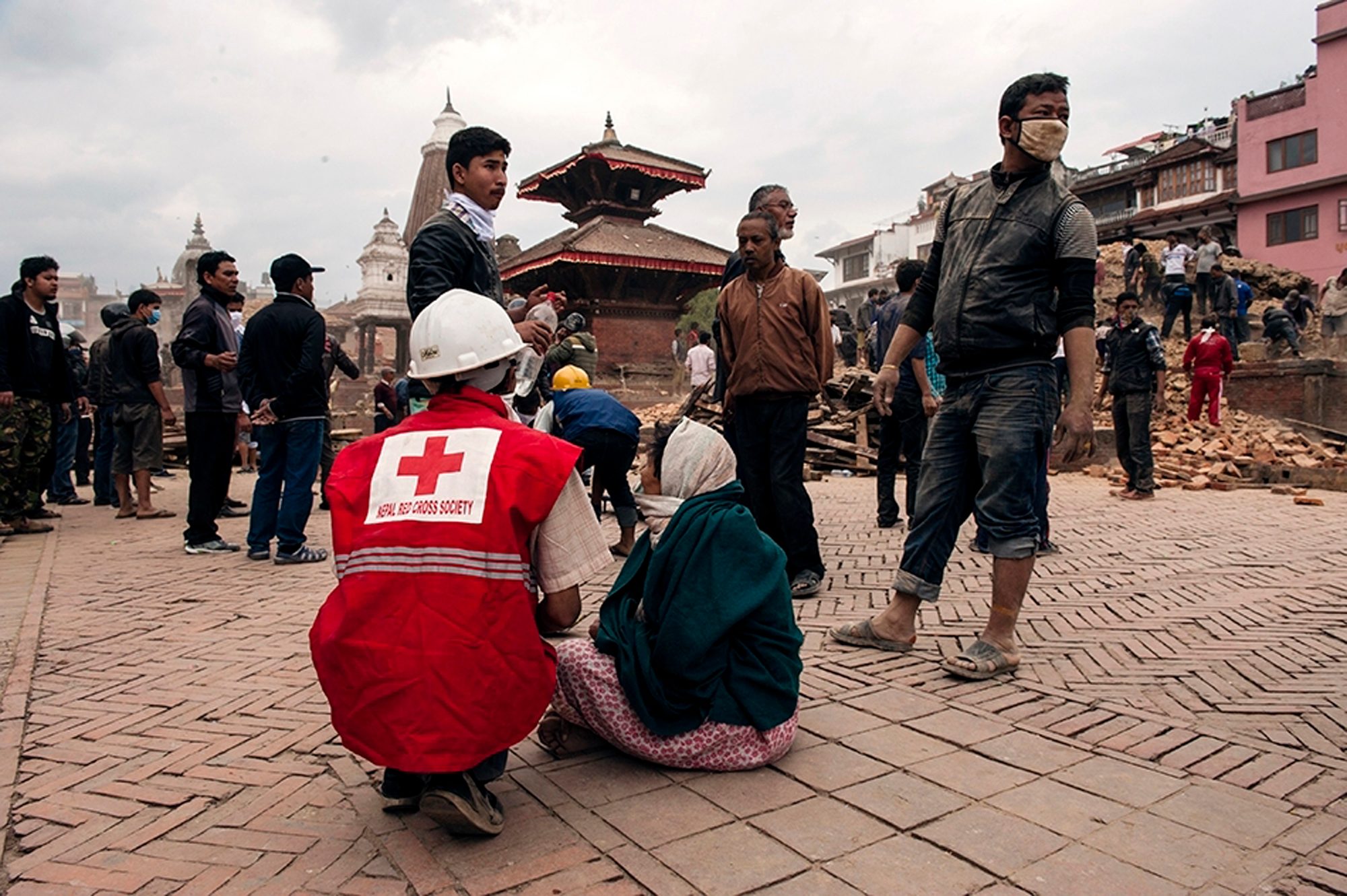 HELPING HAND. A handout photo provided by the International Federation of the Red Cross (IFRC) on 26 April 2015 of rescue workers from the Nepal Red Cross Society helping injured people in Kathmandu, Nepal, April 26, 2015. Carl Whetham/IFRC/Handout/EPA 