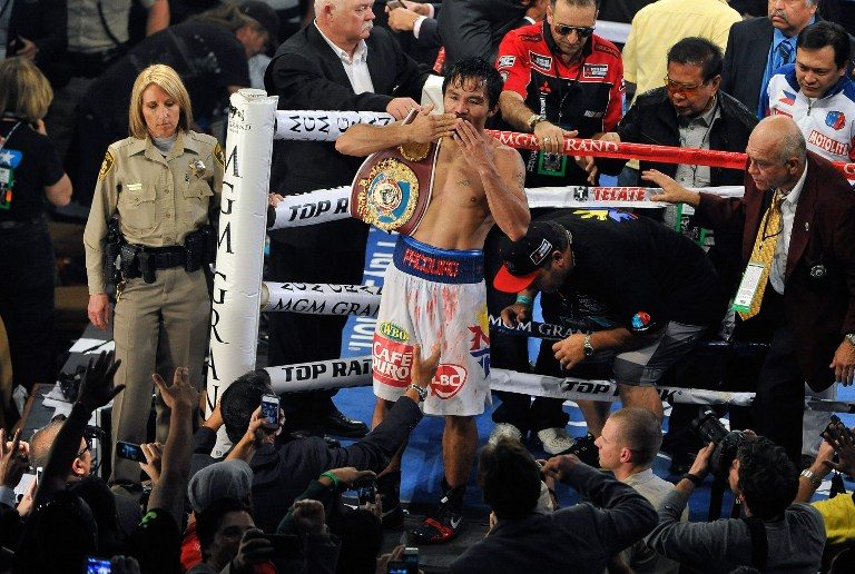 Manny Pacquiao celebrates after his unanimous decision victory over Timothy Bradley during their WBO world welterweight championship boxing match at the MGM Grand Garden Arena on April 12, 2014 in Las Vegas, Nevada. David Becker/Getty Images/AFP
