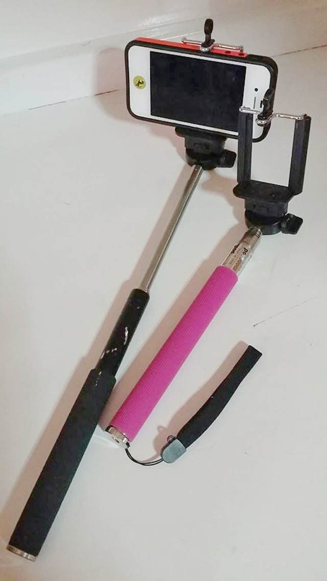 SELFIE HELP. Monopods are widely available. The black unbranded one here was bought for P700 at Starmall Mandaluyong, and the pink (also unbranded) one for P150 at a tiangge in Alabang. Photo by Jun Baris