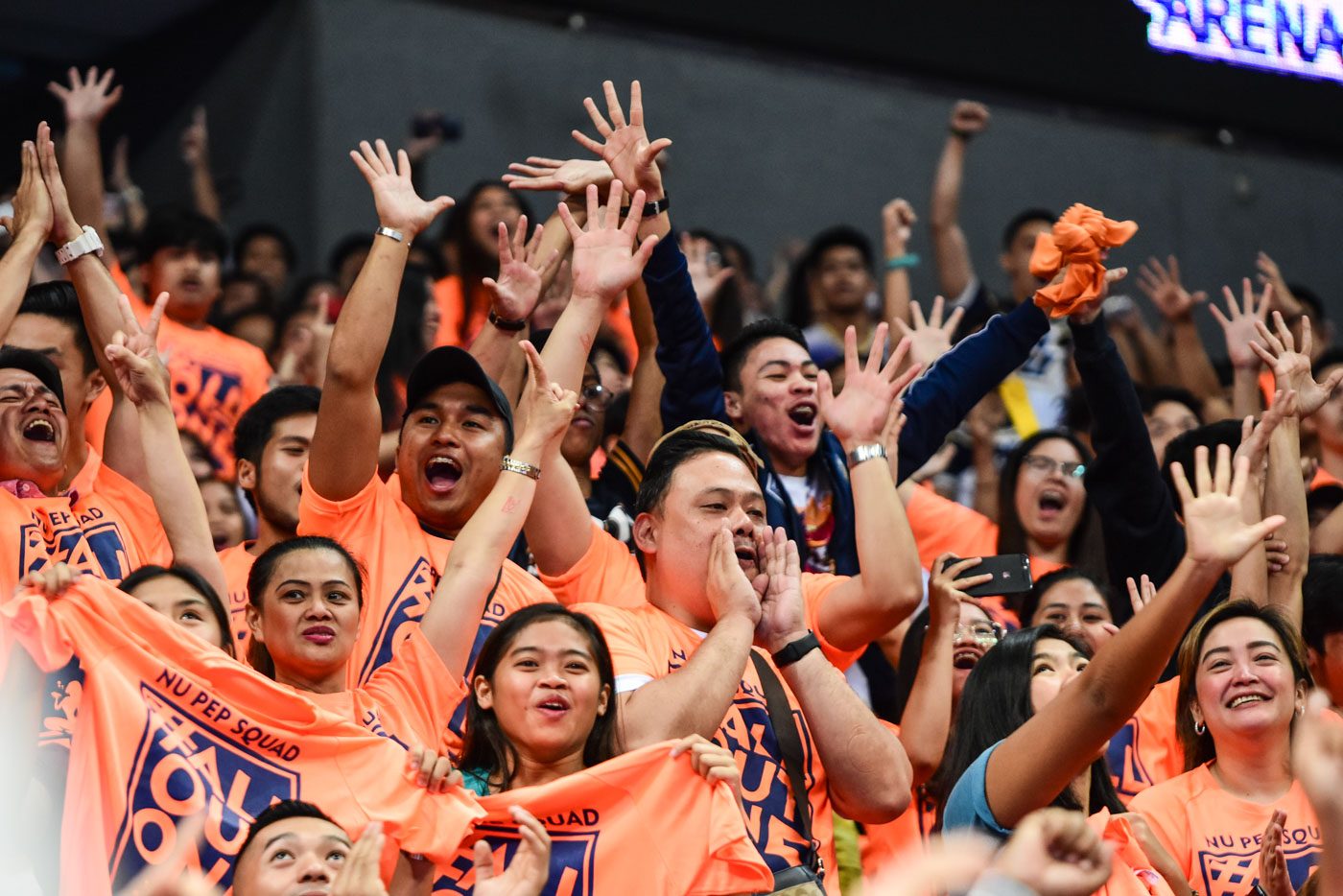 ECSTATIC. The NU supporters came in orange shirts that stated "All Out on 5" to light up the MOA Arena. Photo by Alecs Ongcal/Rappler  