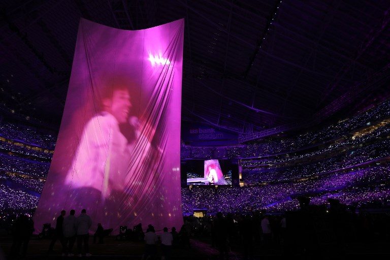 PRINCE. Justin Timberlake performs as the image of the late singer Prince flashes during the Pepsi Super Bowl LII Halftime Show at US Bank Stadium. Photo by Patrick Smith/Getty Images/AFP 