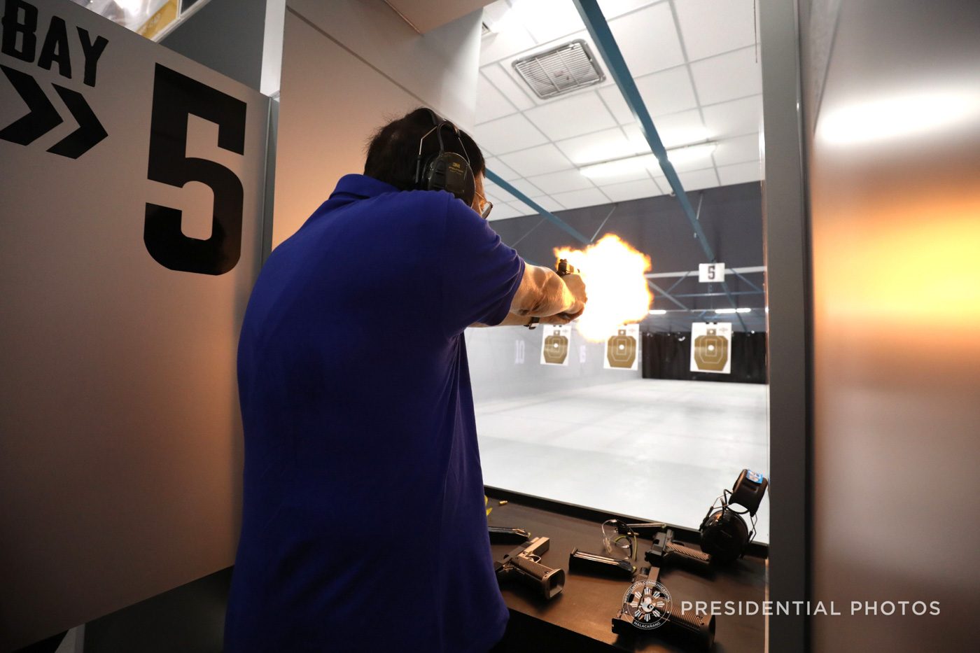 SHOOTING. President Rodrigo Roa Duterte fires a few rounds from the .45, .40 and 9mm caliber pistols as he leads the ceremonial shoot during the inauguration of the Armscor Shooting Range Davao Branch in Davao City on February 26, 2018. Photo by Toto Lozano/Presidential photo 