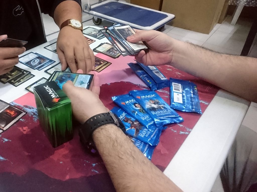 CARDS. A sealed deck tournament underway. Players open booster packs and build decks on the spot. Photo by Iñigo de Paula/Rappler 