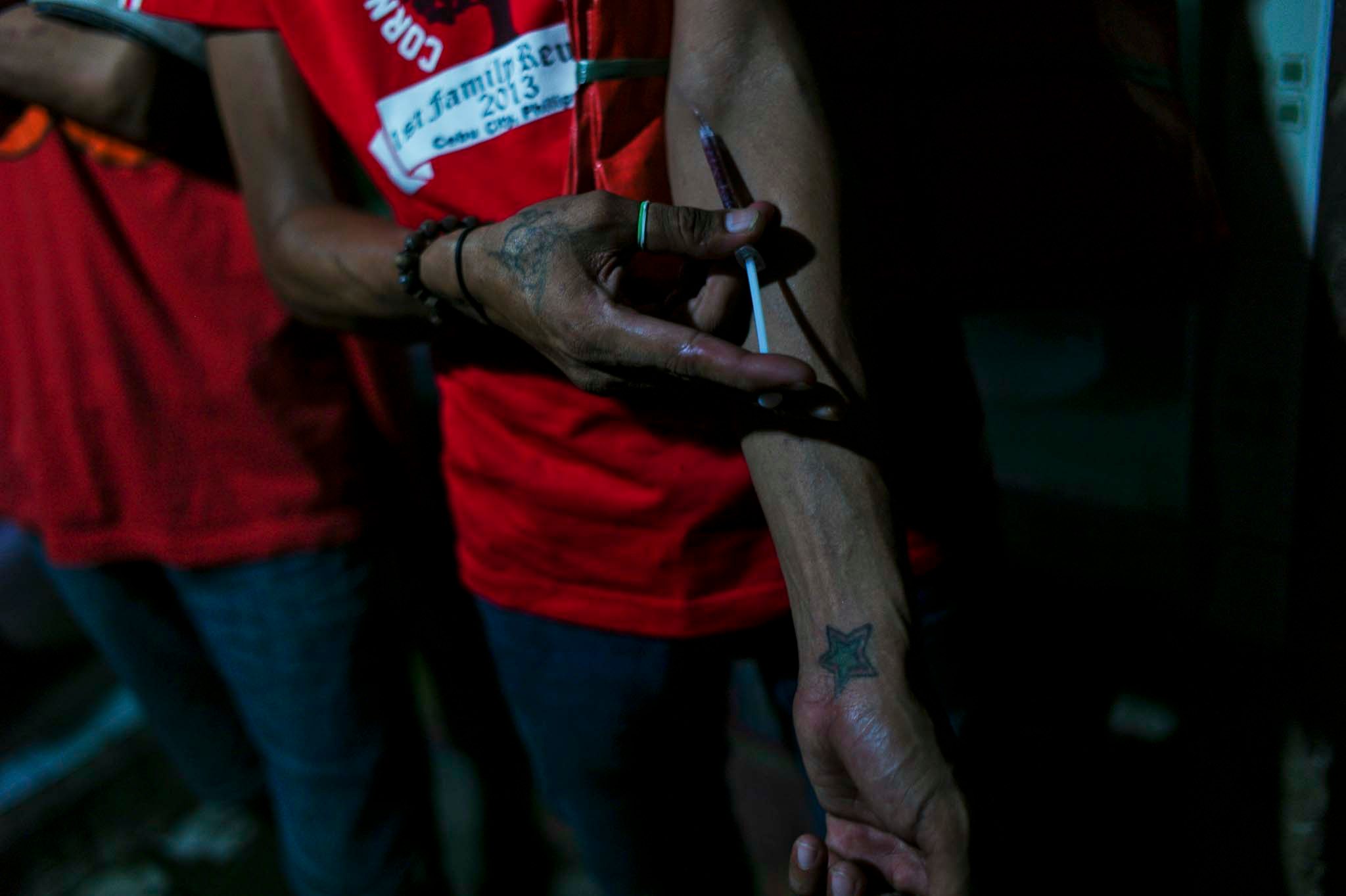 INJECTION. A drug user injects a mixture of Nubain, a narcotic painkiller. Even with the strict regulations, Nubain is common amongst 'shooters' because they can purchase it in increments as cheap as P20 ($.50). Photo by Veejay Villafranca/Pulitzer Center for Crisis Reporting  