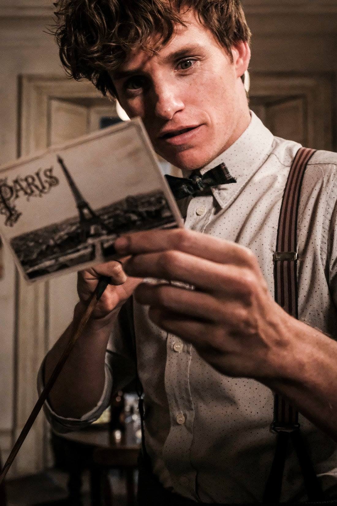NEW ADVENTURE. Newt Scamander holds an intriguing postcard from Paris. Photo from Facebook.com/pottermore 