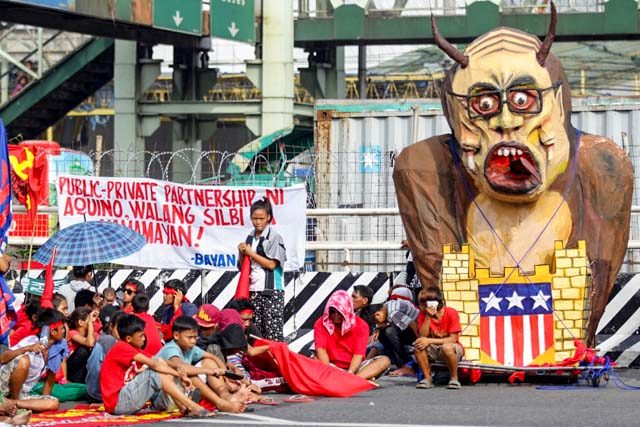 Activists pile up early along Commonwealth Avenue on Monday morning prior to the President's State of the Nation Address. Photo by Josh Albelda/Rappler Photo by Josh Albelda/Rappler