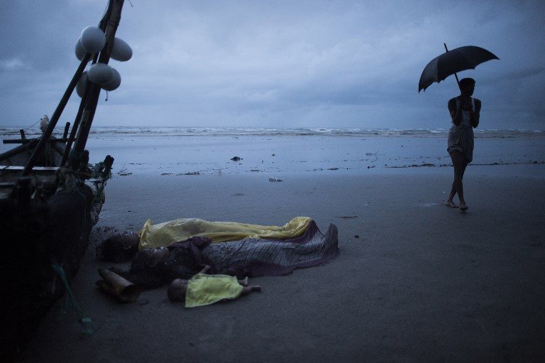 CRISIS CASUALTIES. Dead bodies of Rohingya Muslim refugees lay on the shore of Inani beach, near Cox's Bazar on September 28, 2017. Photo by Fred Dufour/AFP  