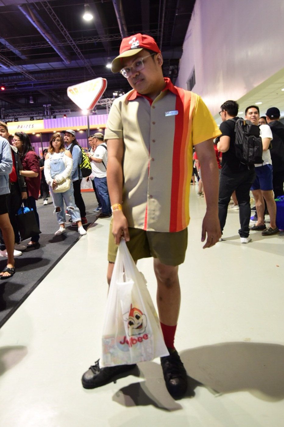 NOT ALL HEROES WEAR CAPES. Jollibee fan Gelo cosplays as a server at the fastfood chain.  