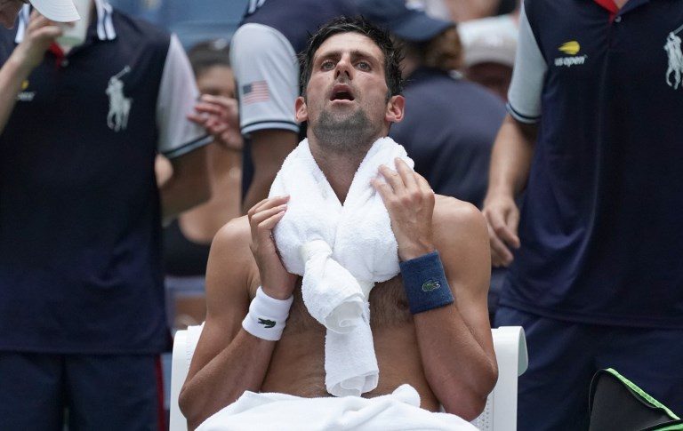 Djokovic in survival mode as heat delivers beating