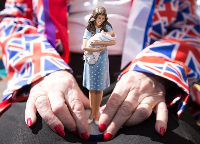 BABY WATCH. A royal fan holds a figurine of the Duchess of Cambridge outisde the Lindo Wing at St. Mary's Hospital in north London, Britain, April 21, 2015. Facundo Arrizabalaga/EPA  