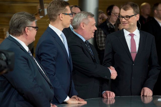 PARTY LEADERS. Finnish Centre Party leader Juha Sipila (R) congratulated by Social Democratic Party leader Antti Rinne (2-R) with True Finns leader Timo Soini (L) and National Coalition Party leader Alexander Stubb (2-L) as they attend the Election media evening at the Parliament building in Helsinki, Finland, 19 April 2015. Markku Ojala/EPA 