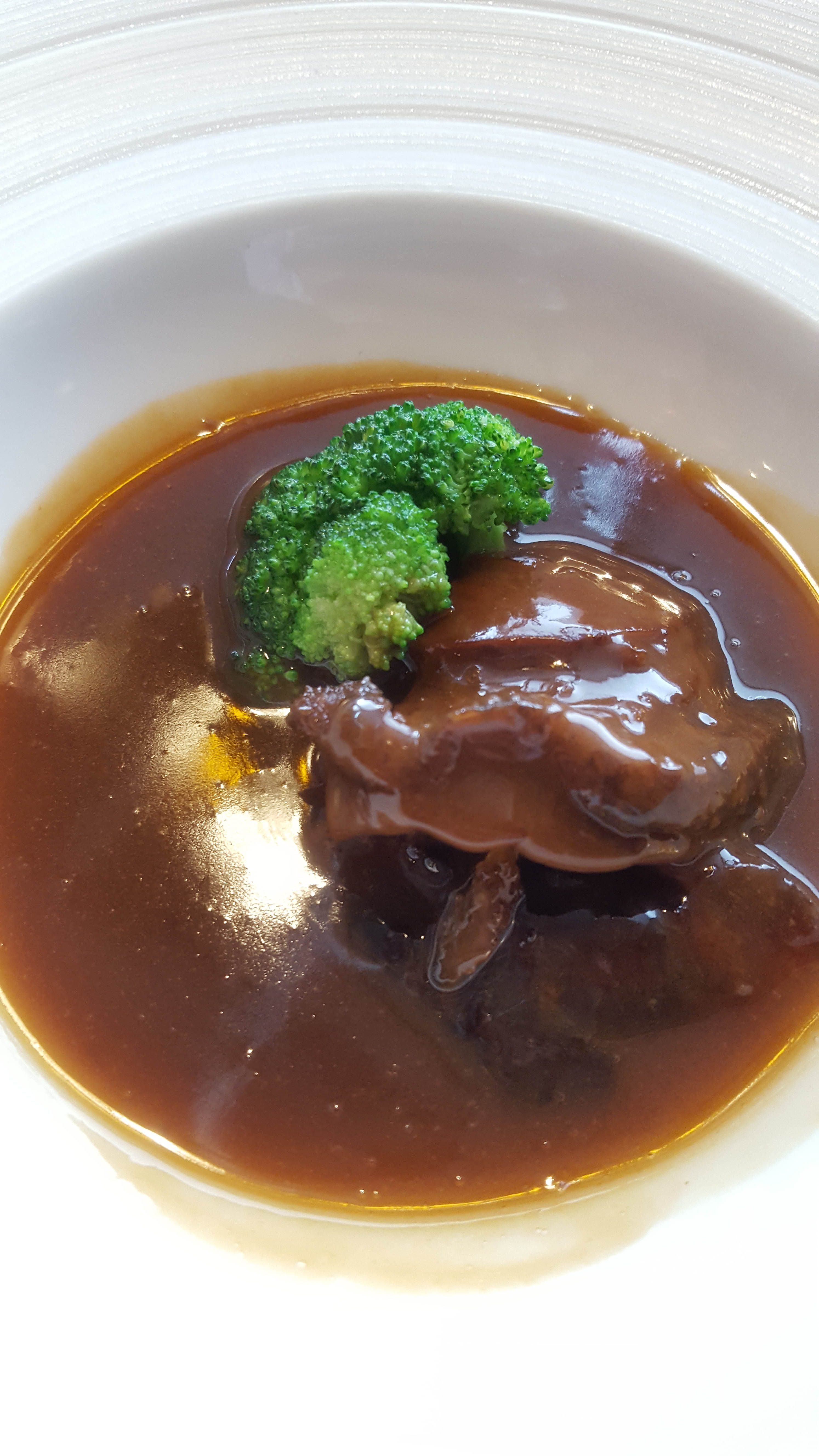 Braised whole South African abalone in oyster sauce. Photo courtesy of Tedrick Yau 