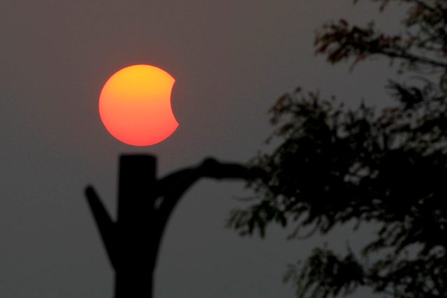 GOLDEN SUNRISE. A partial solar eclipse is seen in Naypyitaw, Myanmar, March 9, 2016. Hein Htet/EPA 