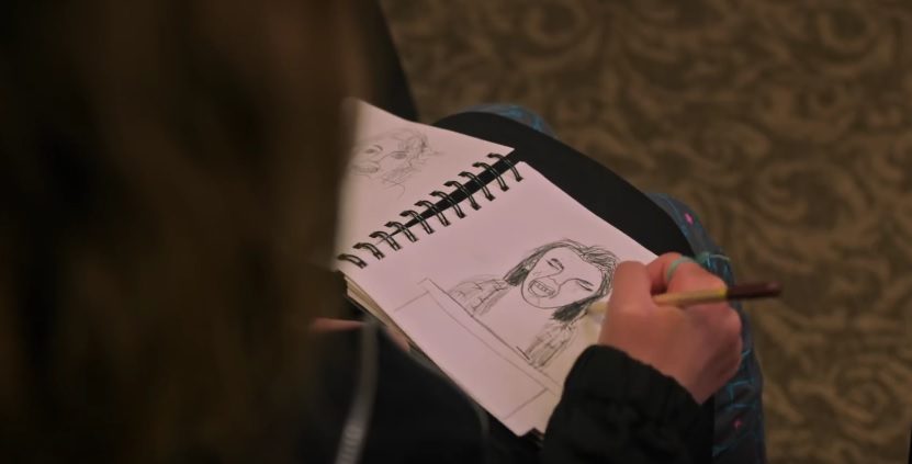 SKETCHES. Charlie (Milly Shapiro) is shown sketching in her notebook. 