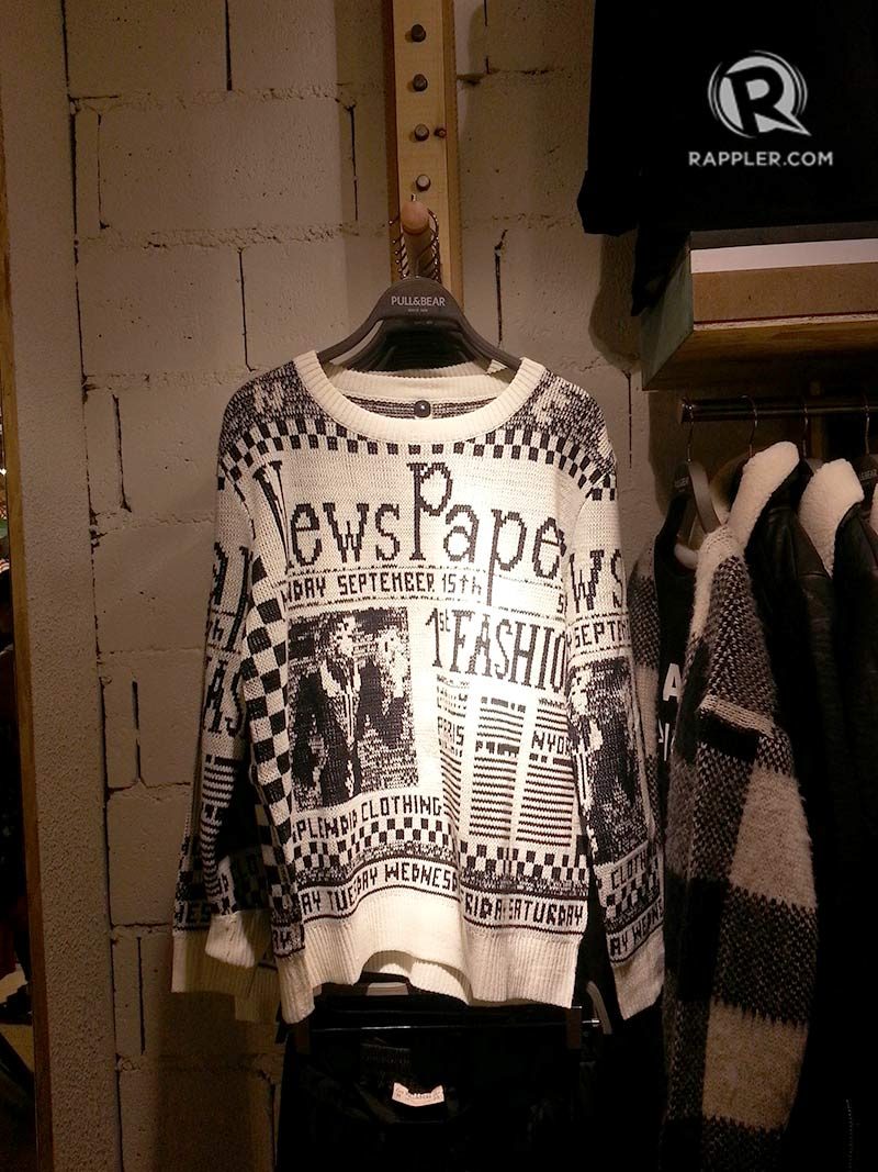 TRENDY AND CASUAL. A sweater hanging among other black and white items in a section of Pull & Bear 