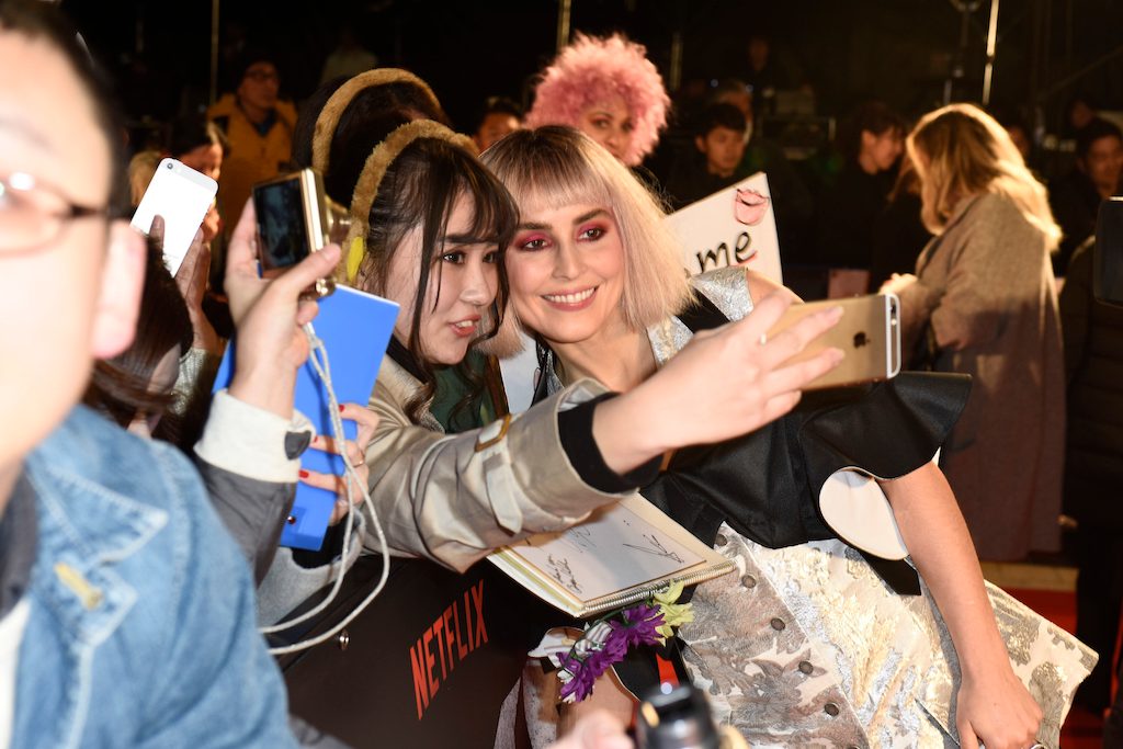 RED CARPET SELFIE. Noomi Rapace takes a snap with a fan at the red carpet premiere of Netflix's 'Bright' in Tokyo. Photo courtesy of Netflix  