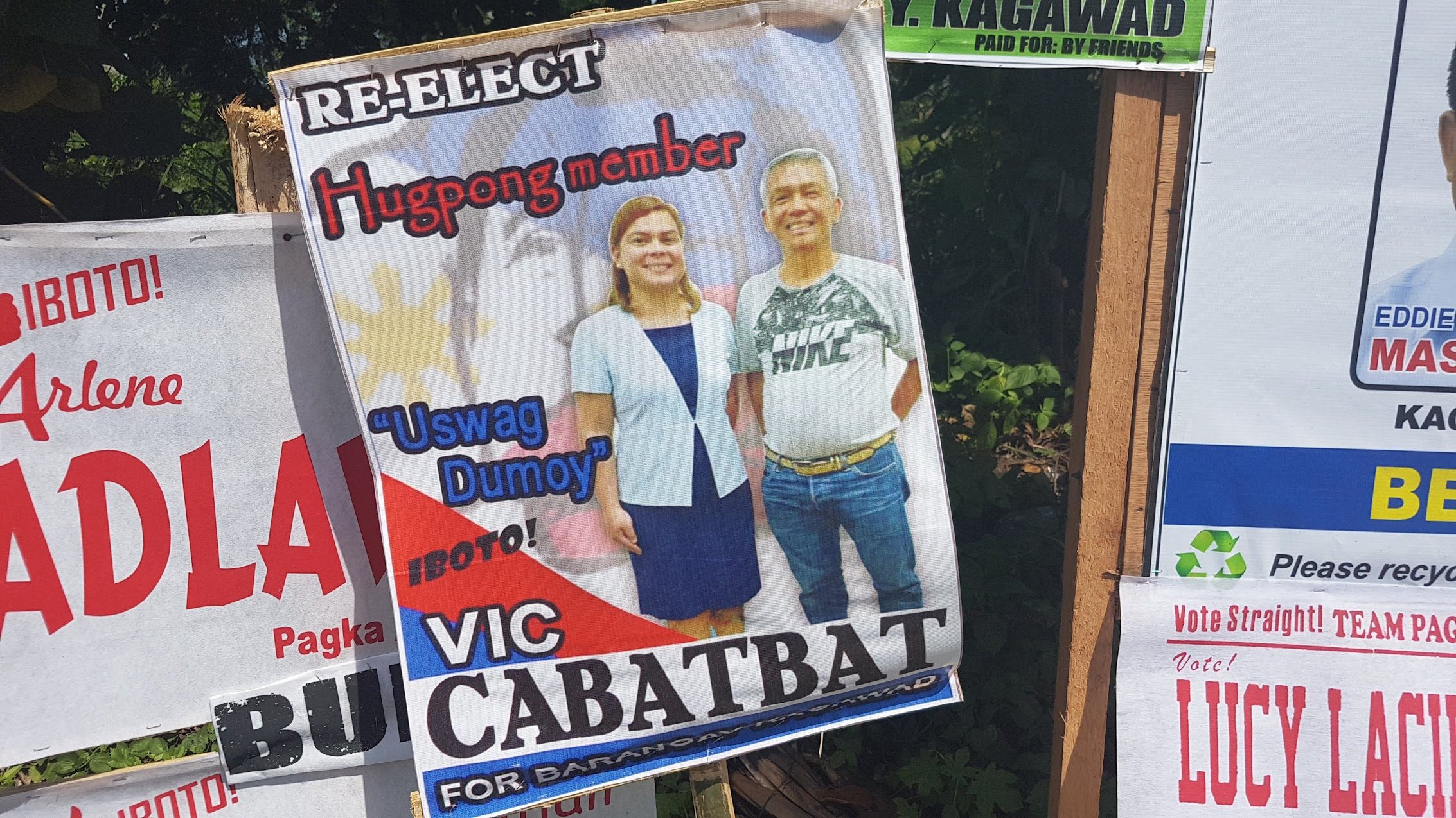 HUGPONG MEMBER. Barangay Dumoy kagawad candidate Vic Cabatbat is seen with Davao City Mayor Sara Duterte in his campaign poster. Photo by Mick Basa/Rappler   
