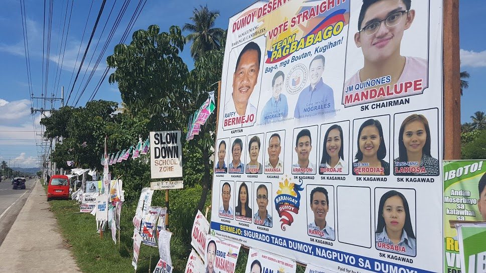TEAM NOGRALES? Poll candidates in Barangay Dumoy are shown in one huge poster with pictures of Davao City 1st District Representative Karlo Nograles and PBA Partylist Representative Jericho Nograles. Photo by Mick Basa/Rappler  