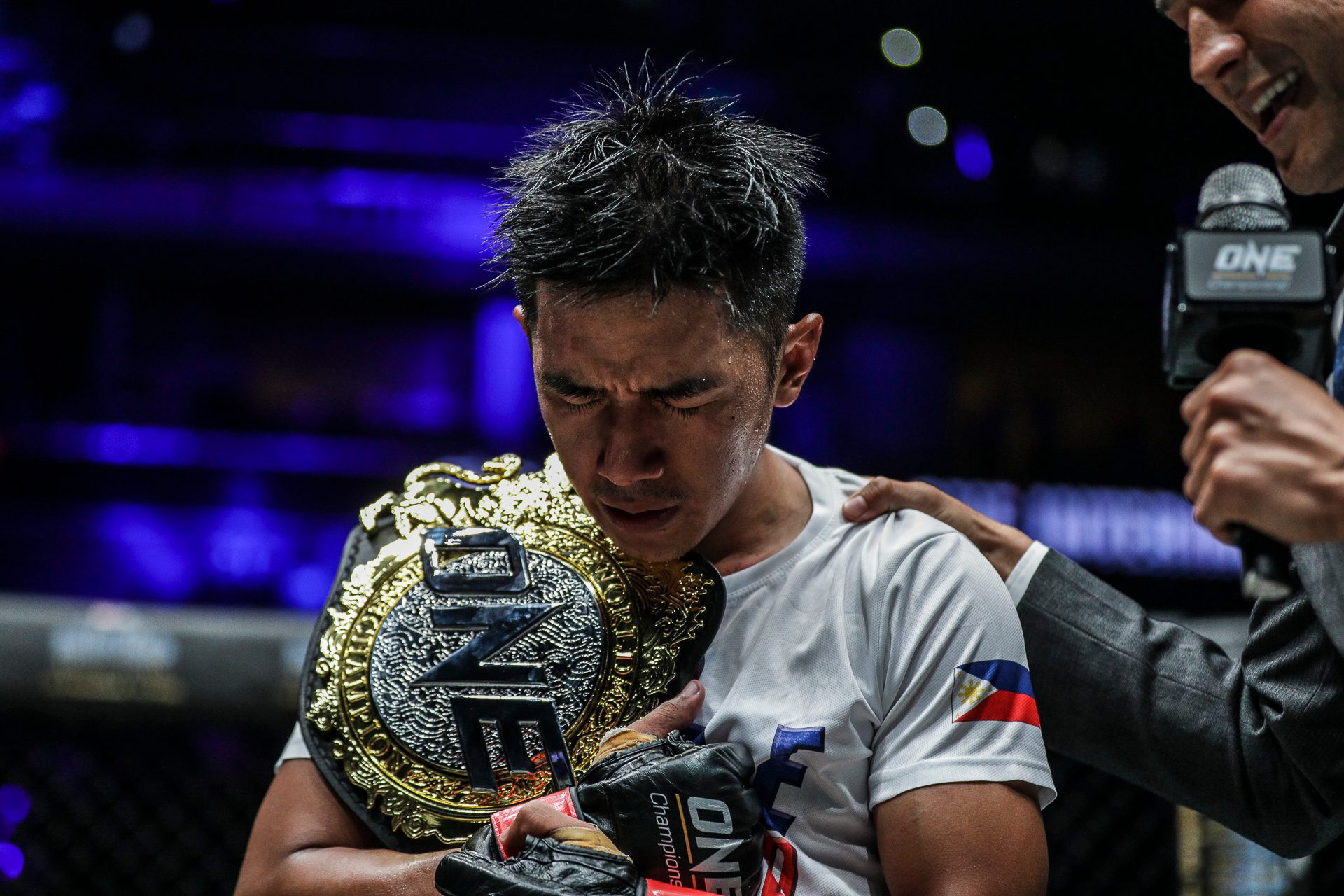 CHAMP. Geje 'Gravity' Eustaquio claims the interim ONE flyweight belt. Photo by ONE Championship 