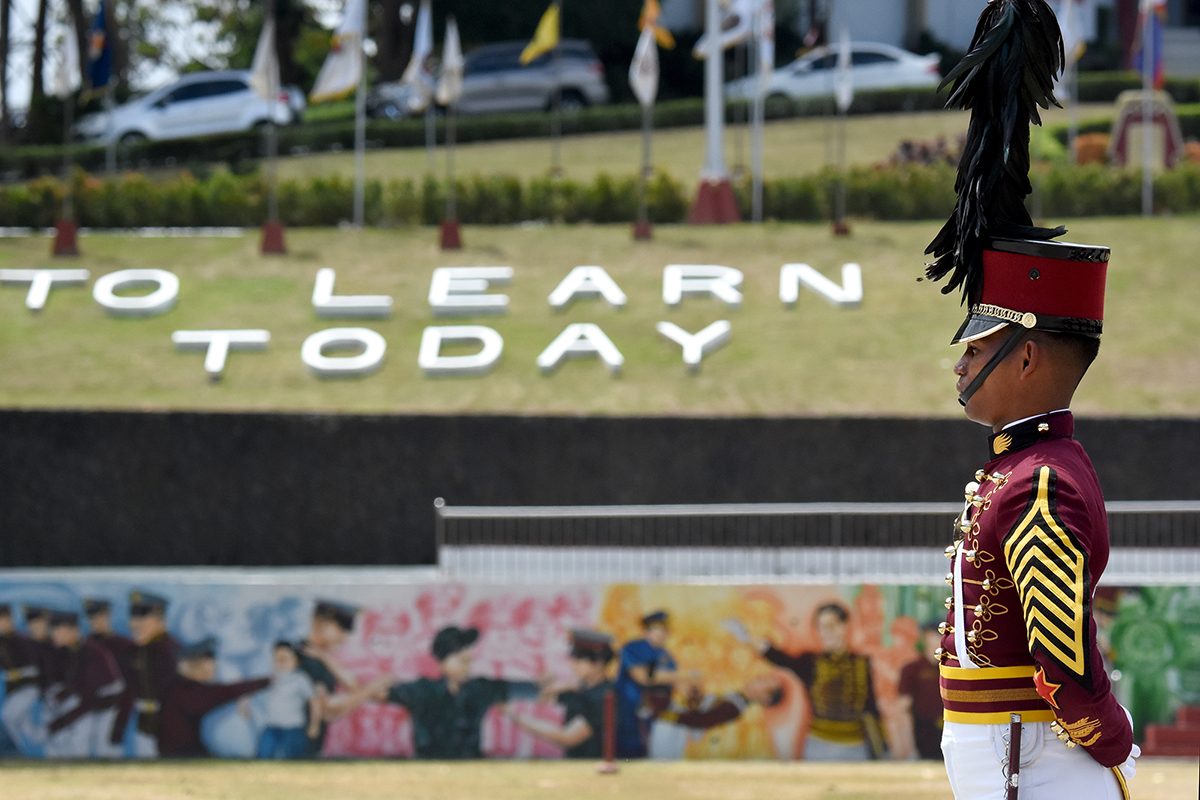 FUTURE AWAITS. A cadet stands guard at the PNPA field before the program begins. Photo by Angie de Silva/Rappler   