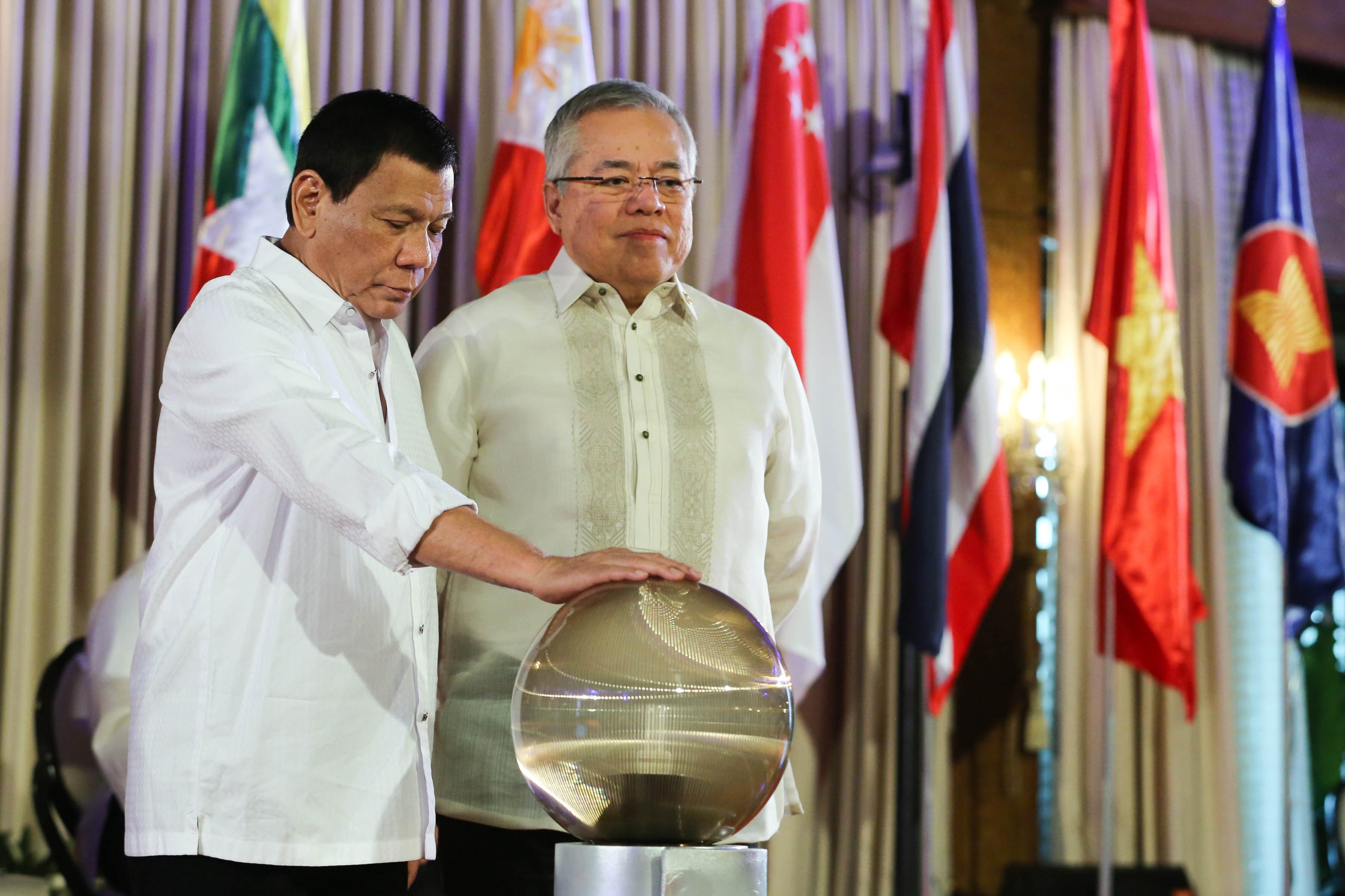 FUELING ASEAN GROWTH. President Rodrigo Duterte is assisted by Trade Secretary Ramon Lopez as he launches the Association of Southeast Asian Nations (ASEAN) 2017 Business and Investment Program at Malacañang Palace on January 24, 2017. Photo by King Rodriguez/Presidential Photo  