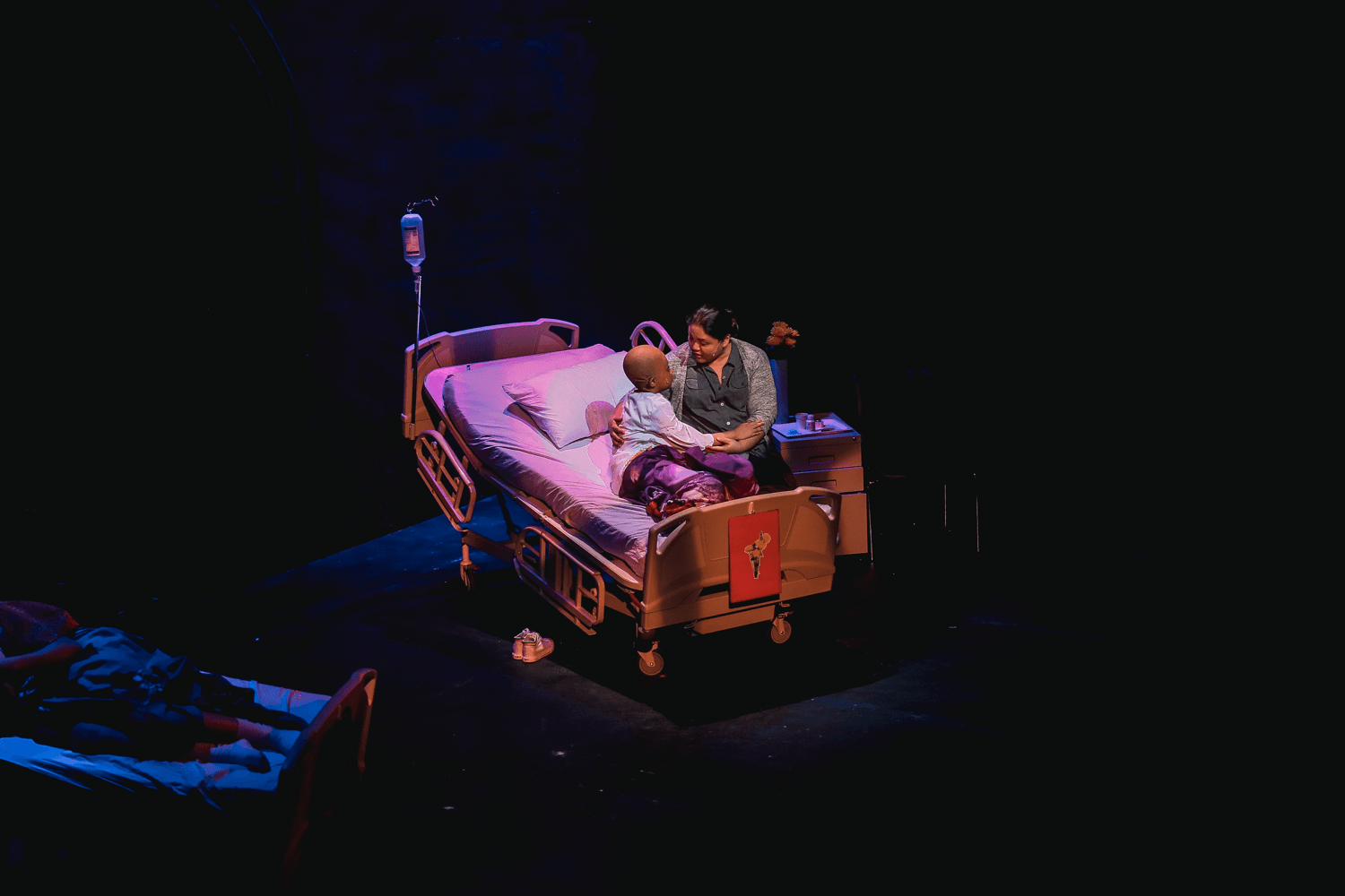 PRAY, PLAY. Katharine, played by Pamela Imperial, urges her cancer-stricken daughter Dani, played by Felicity Kyle Napuli, to pray for recovery. A scene from Dani Girl: A Musical About Hope. Photo courtesy of Gian Nicdao/The Sandbox Collective 