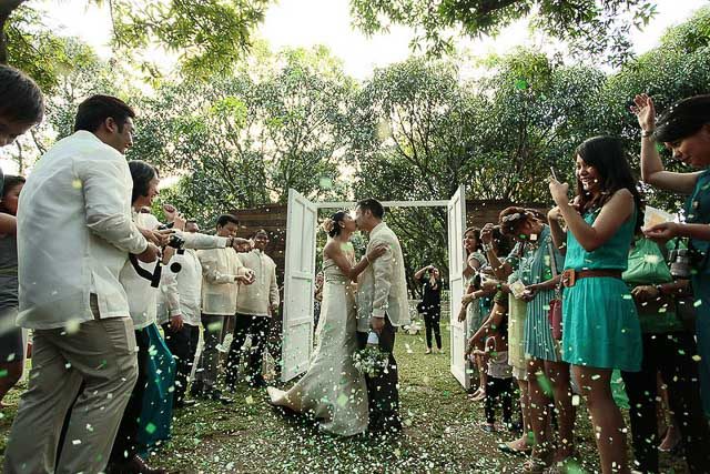 WEDDING DAY. One of many kisses at our wedding at the Mango Farm, Antipolo. Photo by Sunday Morning Studios 