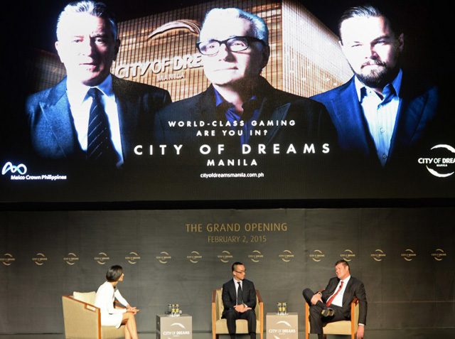 Australian billionaire James Packer (right) and Melco crown co-chairman and with his co-chairman Lawrence Ho (center) during a press conference on the opening of the City of Dreams mega-casino in Manila on February 2, 2015.  Photo by Ted Aljibe/AFP