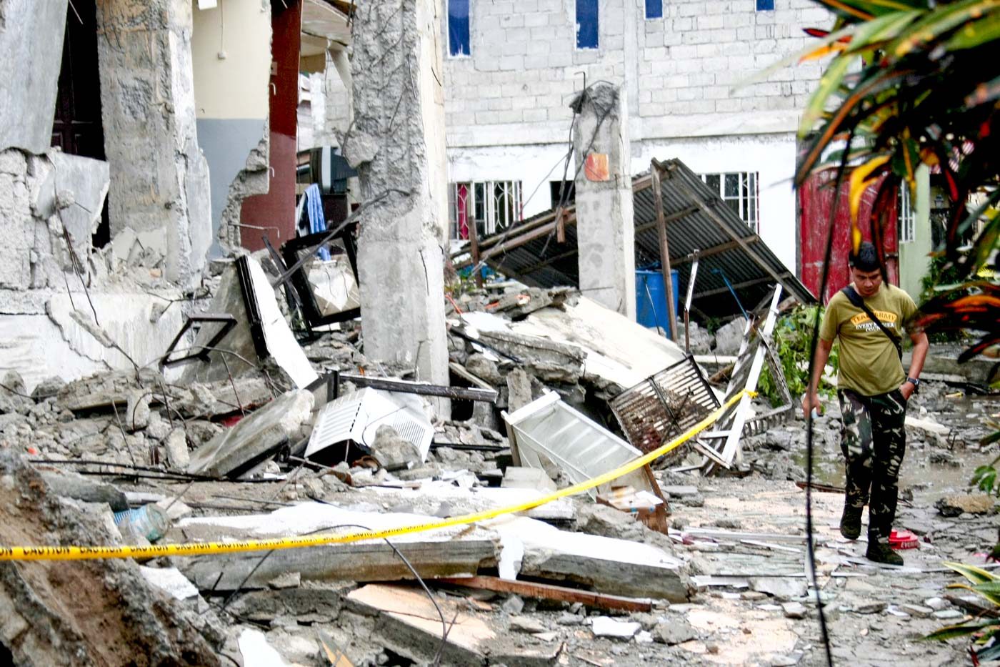 RUBBLE. Police tape surround a damaged building in Leyte. Photo by Gelo Litonjua  