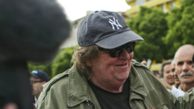 US filmmaker Michael Moore opens home to Syrian refugees