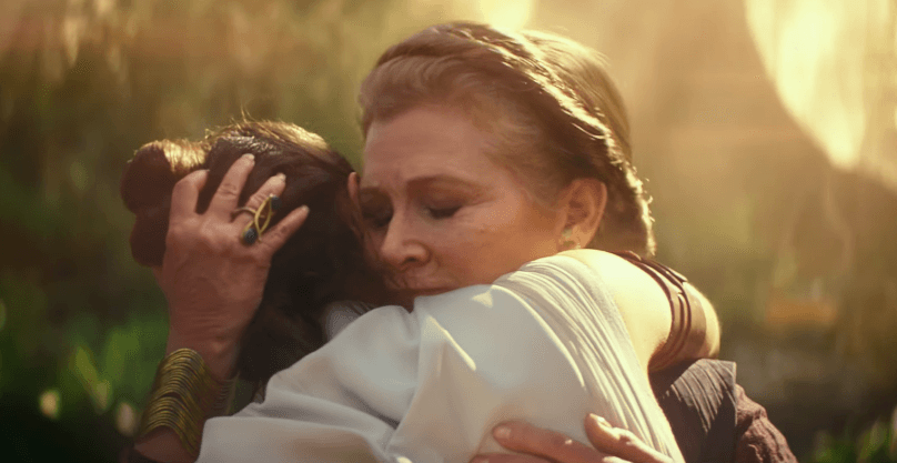 FACE THE FEAR. General Leia Organa (Carrie Fischer) hugs Rey as she faces the battle ahead of her.  
