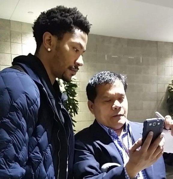 HOMETOWN HERO. The author with former NBA MVP Derrick Rose. Contributed photo  