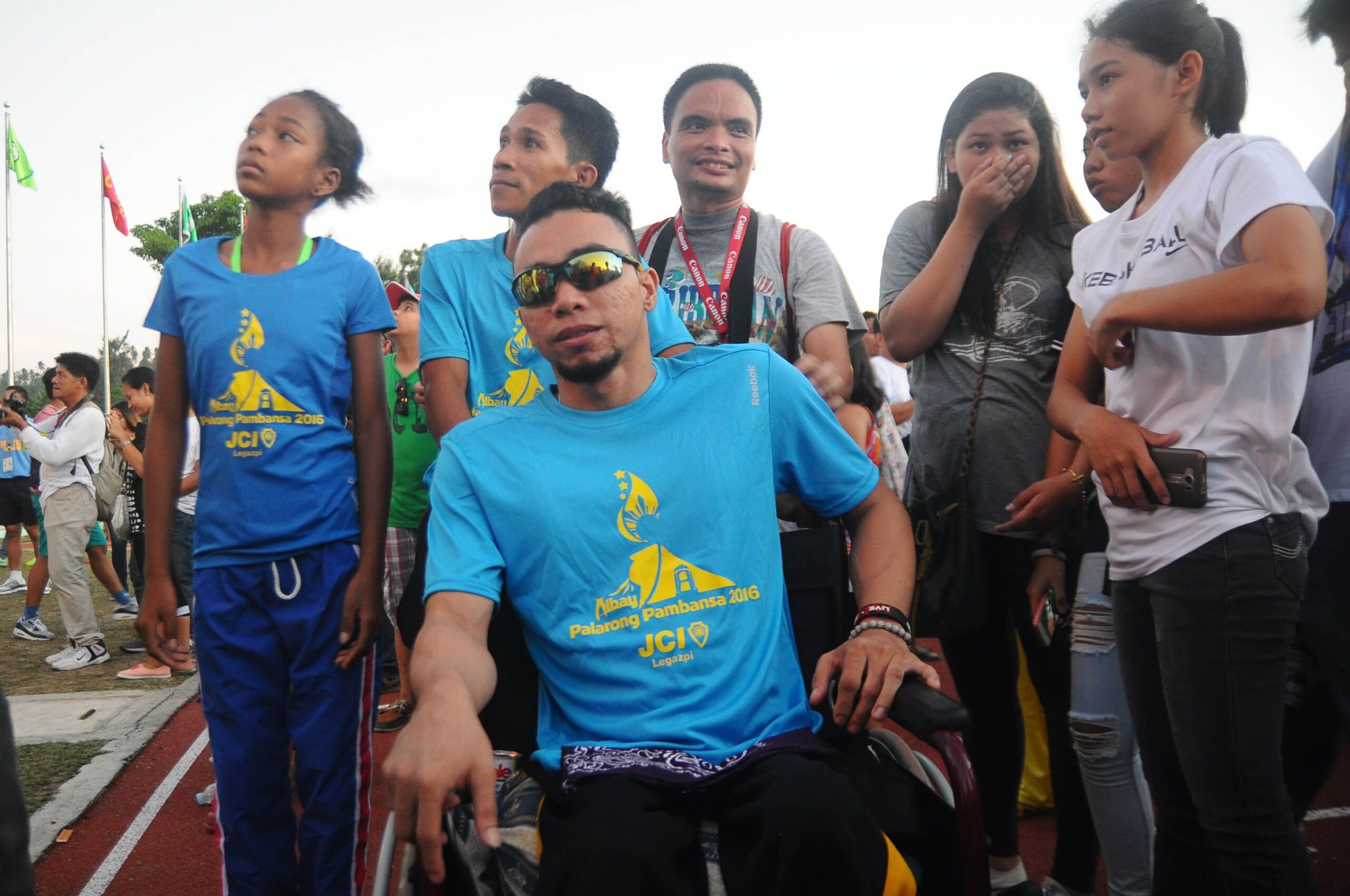 Palaro’s first PWD torchbearer shows sports binds all